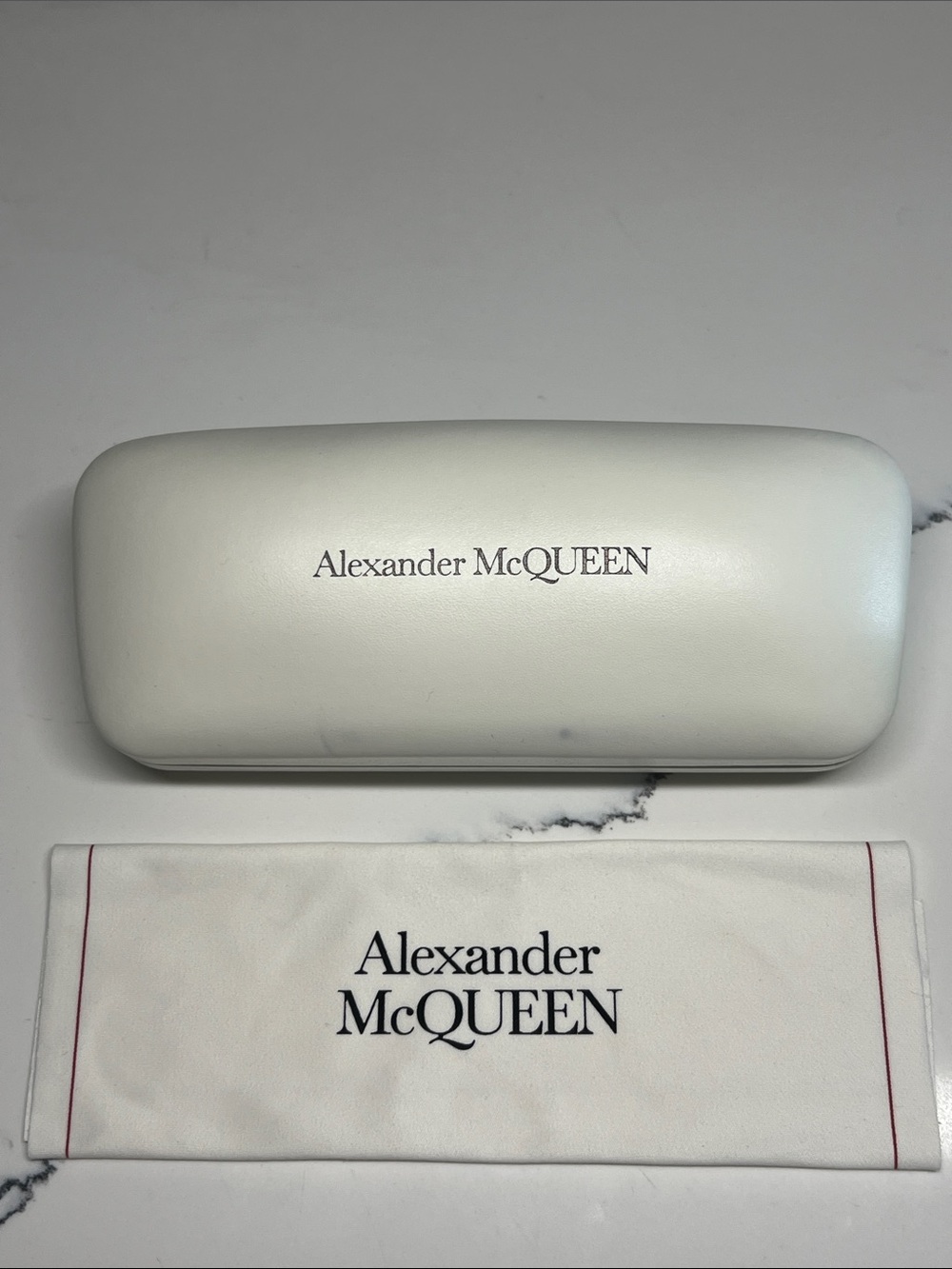 Alexander McQueen white hard clamshell case  w/ matching cleaning cloth